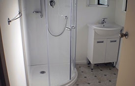 bathroom with shower and toilet